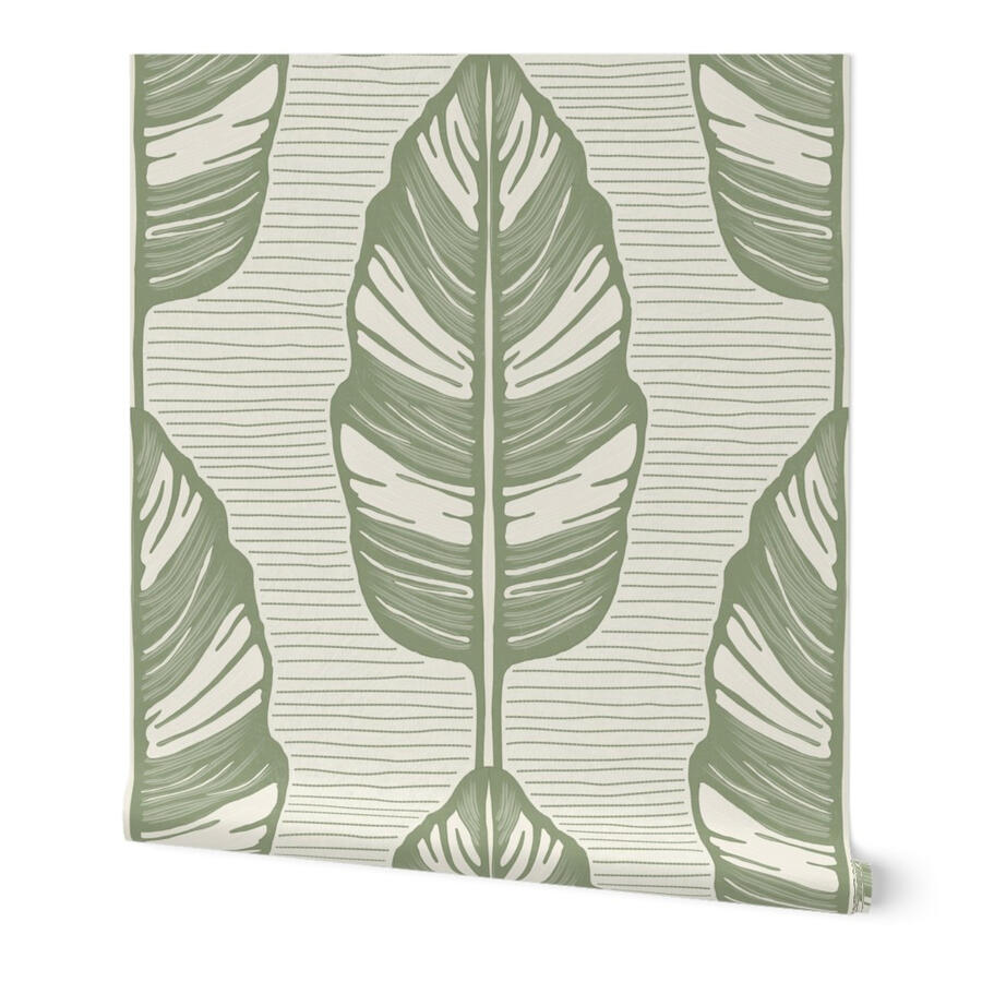 Stylized banana leaf wallpaper in soft sage green by Ania Malt