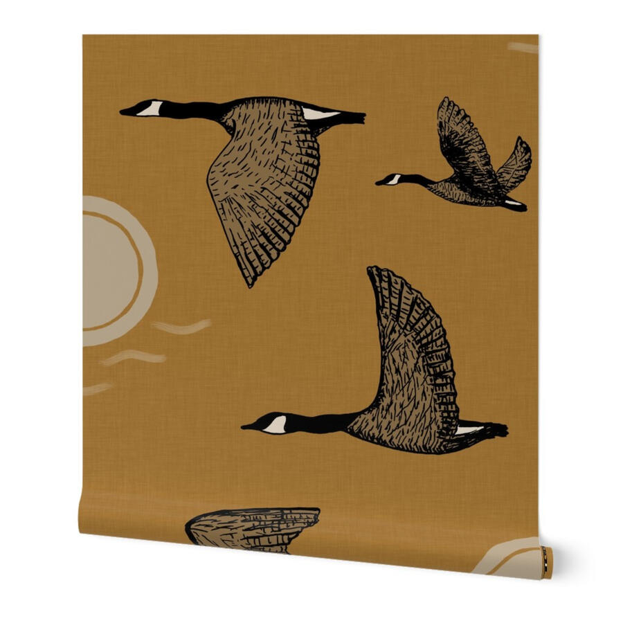 Flying Geese Flying geese wallpaper in golden ochre by Ania Malt